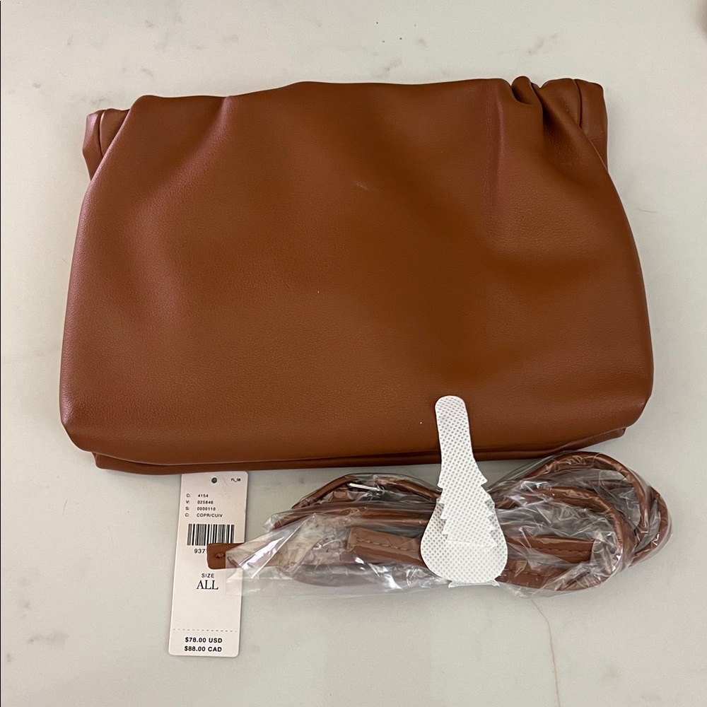 Anthropologie cinched faux leather clutch in Elegant Brown